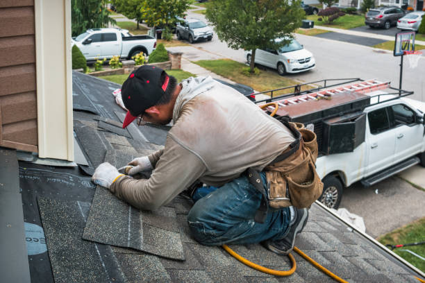 Professional Roofing technician working in Oxford, IA